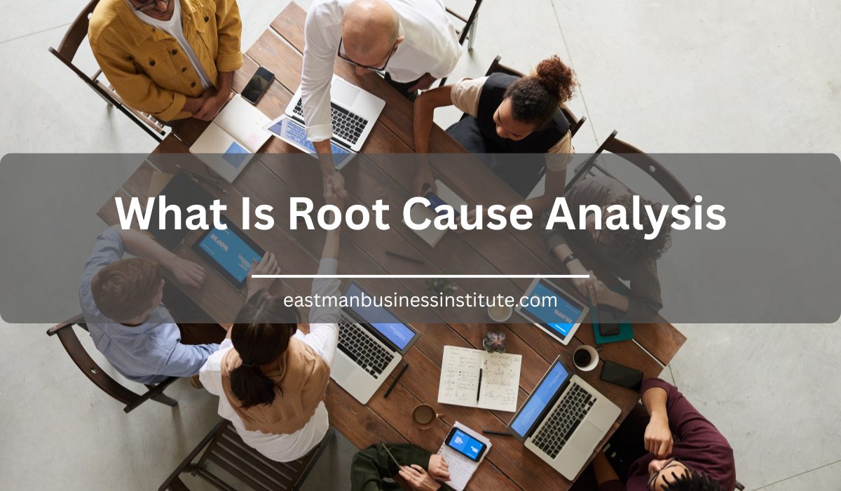 A cross-functional team collaborates around a conference table to demonstrate What Is Root Cause Analysis for identifying and resolving the root causes of business problems.