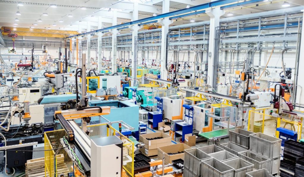 Modern factory floor with automated machinery used to evaluate CPK process capability and optimize manufacturing performance.