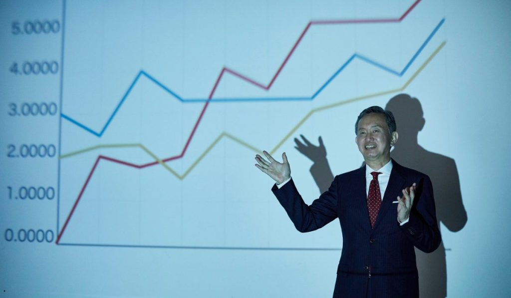Business professional presenting performance trends using a left skew graph to explain statistical data distribution.