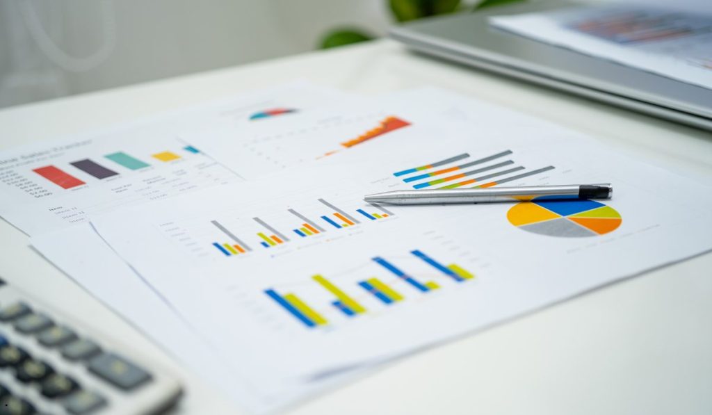 Statistical reports with charts and graphs representing a sampling distribution for data analysis and research.