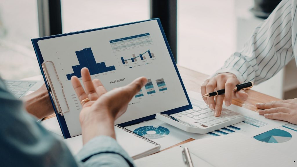 Business Process Intelligence meeting focused on sales reporting, data analysis, and performance measurement using business analytics tools.