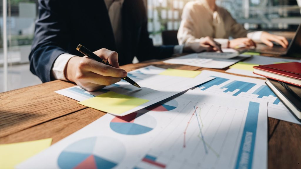 Professionals analyzing business processes and performance data using Deming’s 14 Points of Quality Management principles.