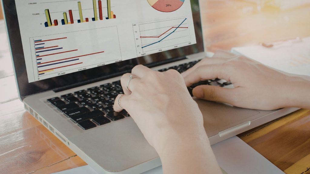 F Value in ANOVA analysis displayed on a laptop, comparing group variances and statistical significance through charts and data visualizations.