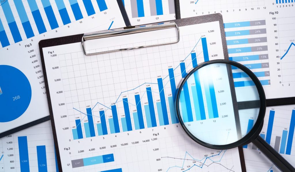 Magnified bar charts and statistical reports highlighting how to calculate sample mean for data interpretation and decision-making.