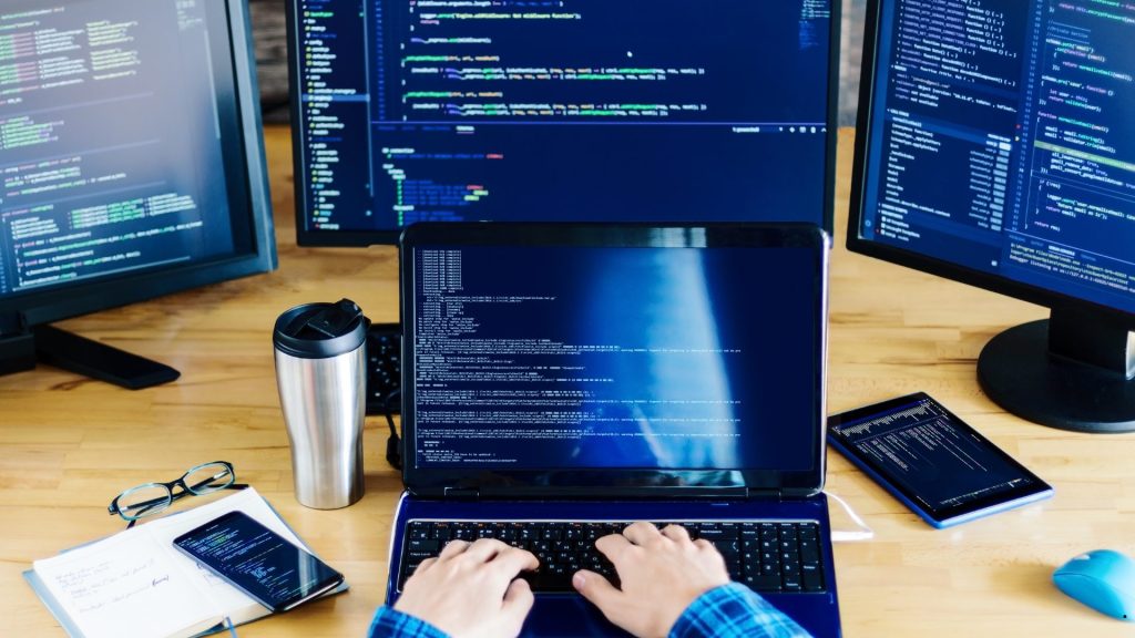 Programmer working with code dashboards and analytics screens illustrating the differences between SE vs SD in data analysis and performance measurement.