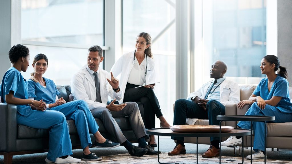 Healthcare professionals collaborating on quality improvement initiatives and patient care optimization using Six Sigma healthcare methodologies.