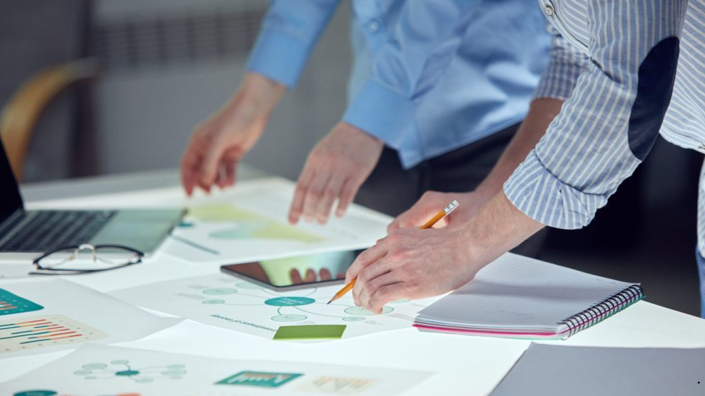 Six Sigma Model team collaboration focused on process mapping, workflow analysis, and continuous improvement planning.
