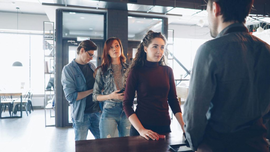 The Two Core Principles of TQM highlighting customer satisfaction, service quality, and process excellence through user-centered design and feedback.