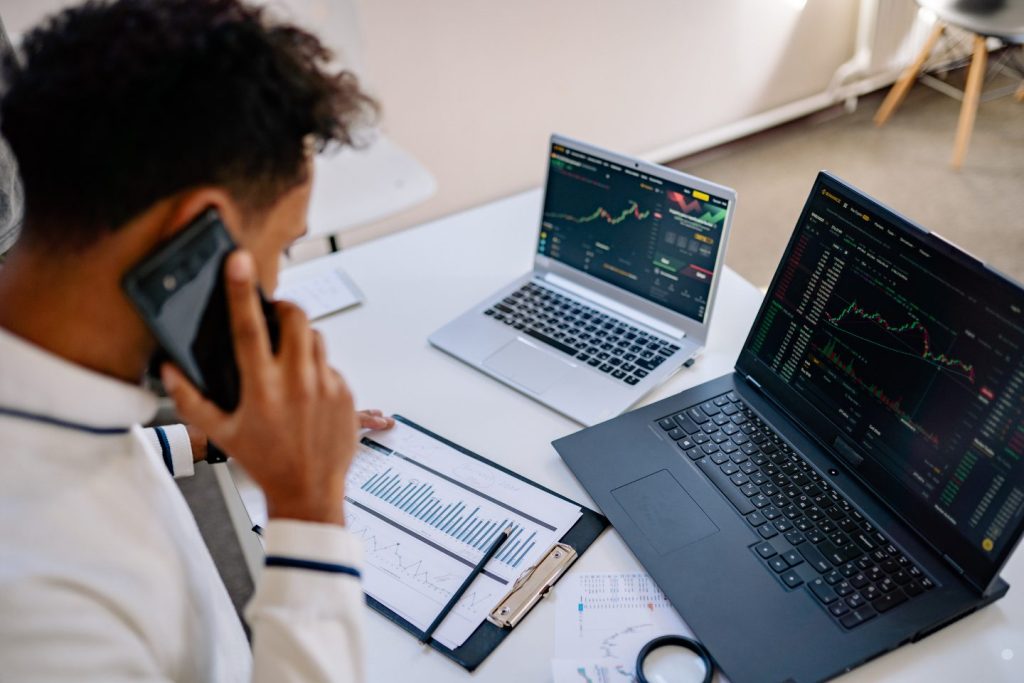 Professional reviewing business performance dashboards and analytics as part of Lean Six Sigma meaning and process improvement analysis.