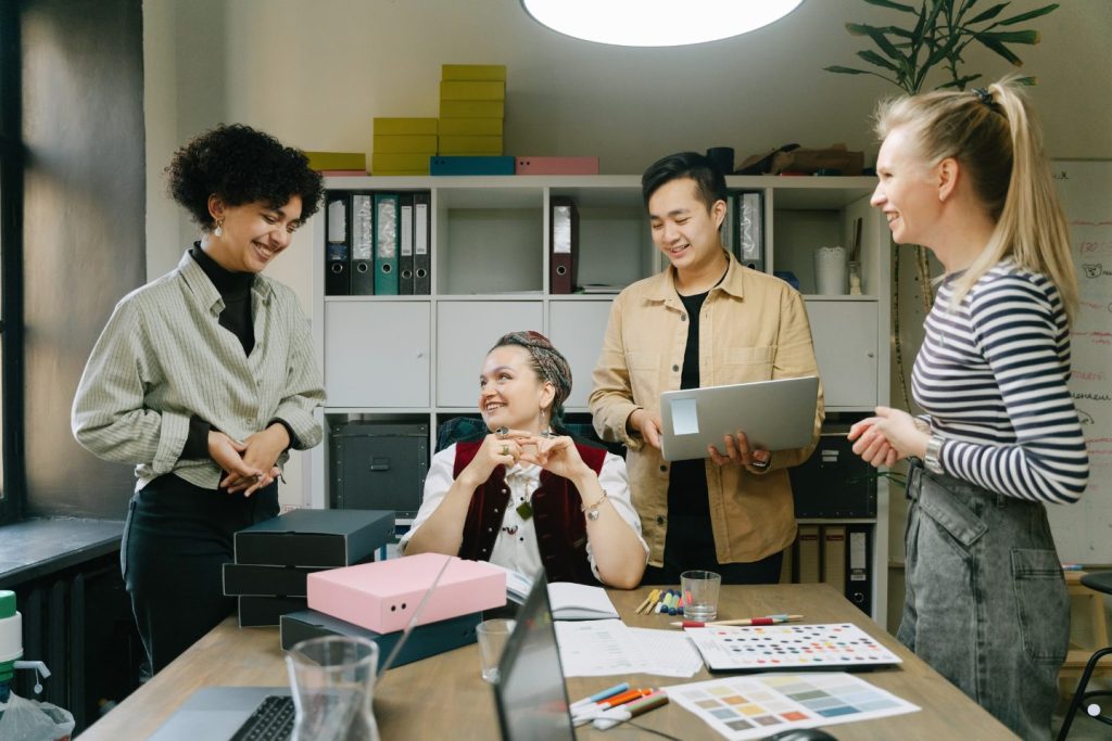 Office management classes focused on teamwork, collaboration, and workplace communication skills in a professional office setting.
