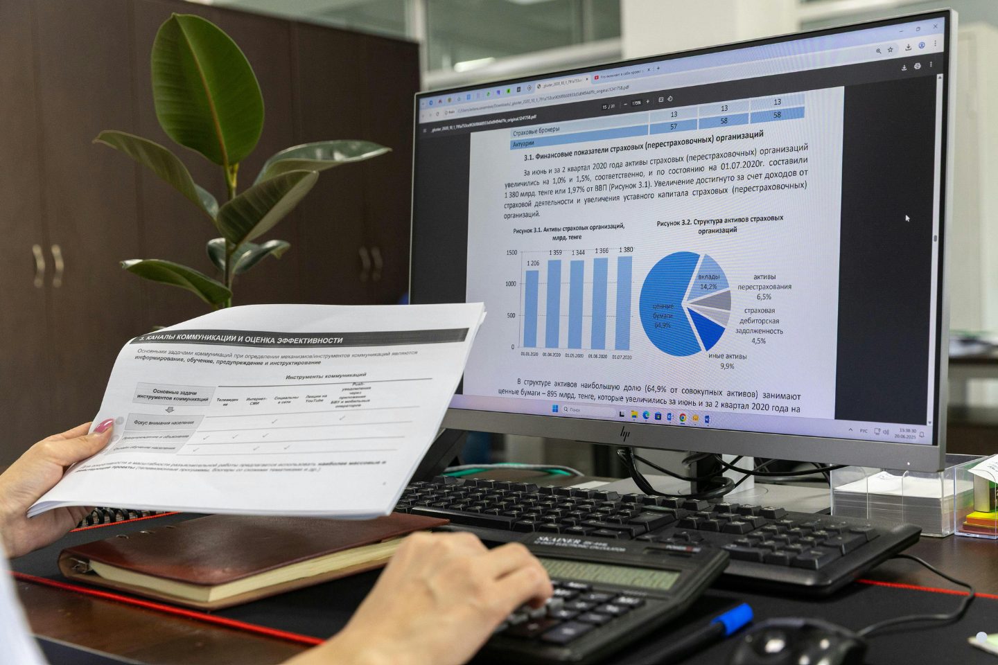 Process analysis workstation displaying financial charts, operational reports, and business performance metrics on a computer screen.