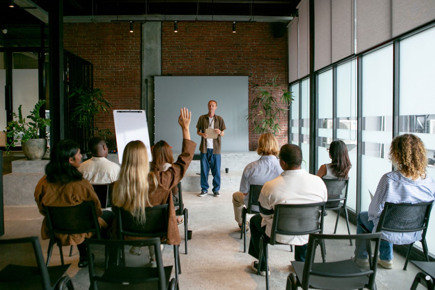 Attendees participating in a Six Sigma Green Belt Training seminar focused on Lean Six Sigma concepts and quality management.