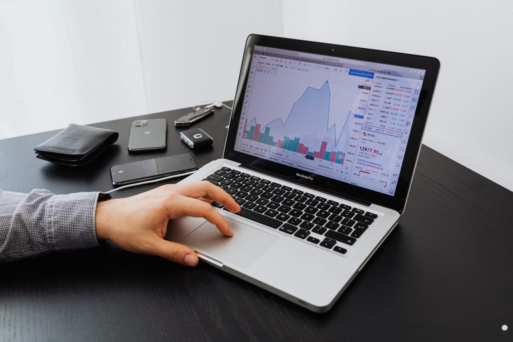 Visual management dashboard showing business performance charts and analytics tracking on a laptop screen during process monitoring.