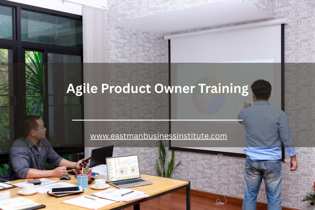 Business trainer presenting agile product owner concepts during a team workshop in a modern meeting room.