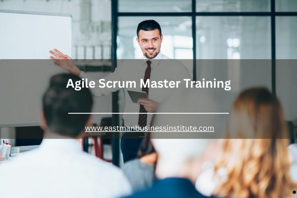 Trainer leading an Agile Scrum Master seminar with participants in a corporate conference room.