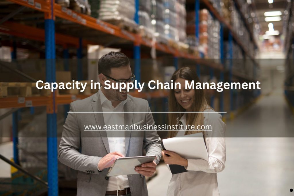 Business professionals reviewing warehouse inventory data on a tablet inside a large supply chain distribution center.