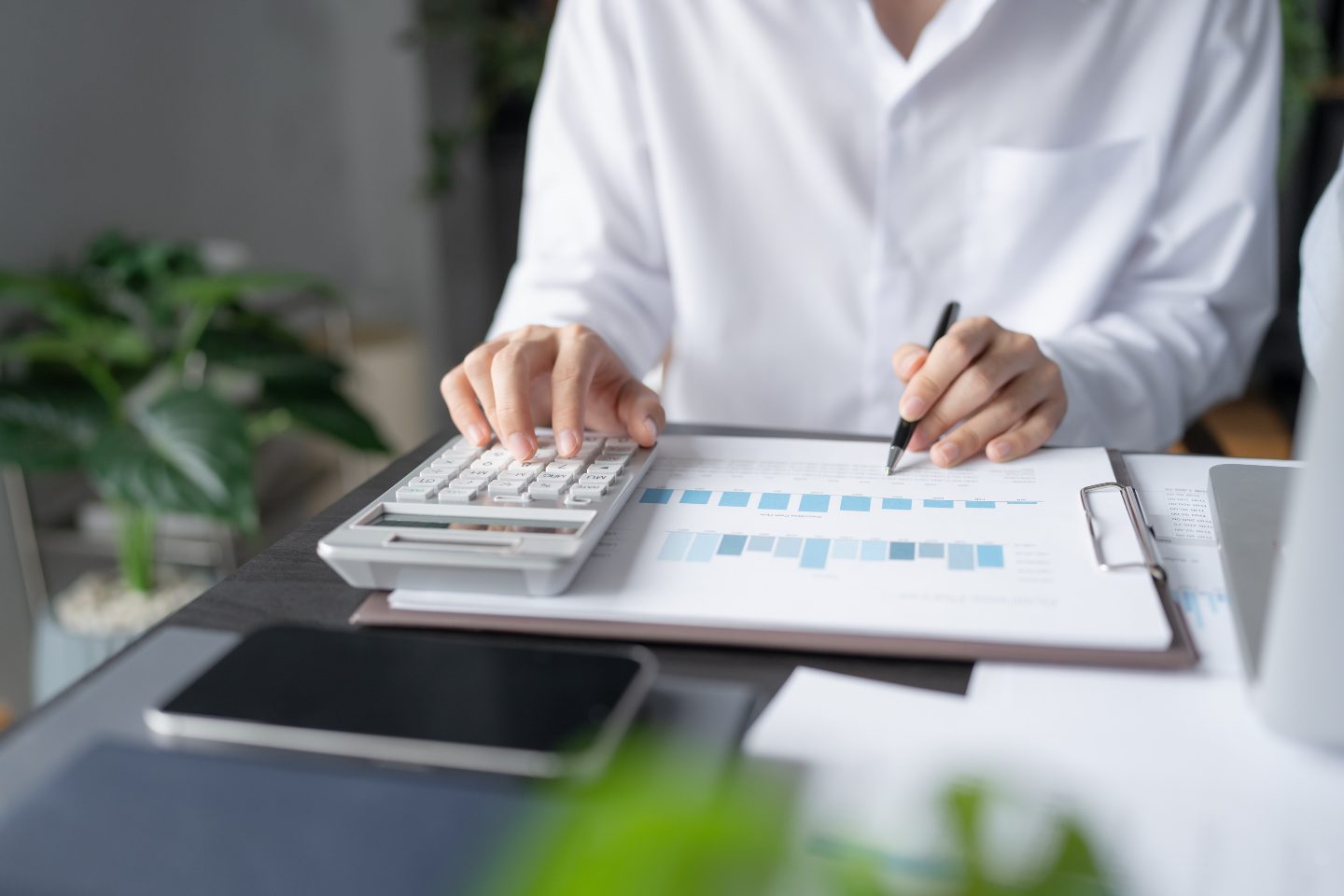 Project manager analyzing budget data and financial reports for effective cost management in project management.