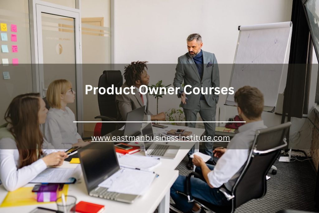 Instructor leading a product owner training session with professionals in a modern office meeting room.