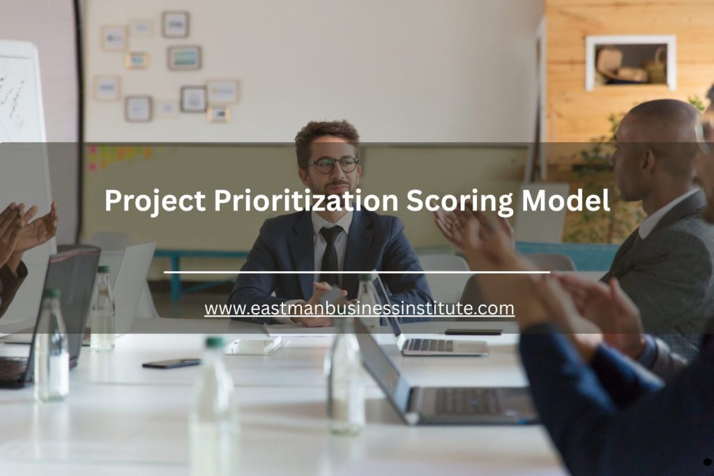 Business team meeting in a conference room with laptops and presentation text reading Project Prioritization Scoring Model.